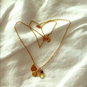 Satya gold necklace with a citrine and garnet